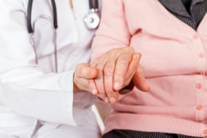 istockphoto Dr Holding hand 664061178 1 300x200 - Young doctor giving helping hands for elderly woman