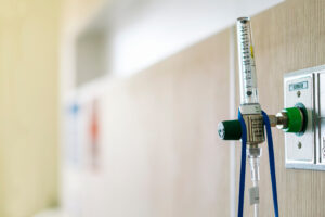 AdobeStock 326718924 300x200 - oxygen flow regulator with tube scale for patients respirator or medical installed in the wall in room at hospital with copy space